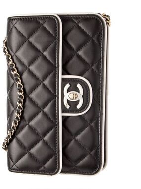CHANEL Black Quilted Leather Shoulder Bag with White Trim and Gold Chain